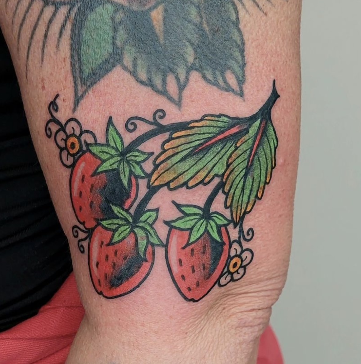 neo traditional tattoo strawberry by vatican lounge in manchester uk