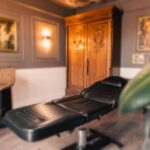 This image displays the Vatican Lounge tattoo studio and shop in Manchester, UK. It highlights the studio’s interior, featuring its design, setup, and overall atmosphere, providing an insight into the space where clients receive tattoo services.